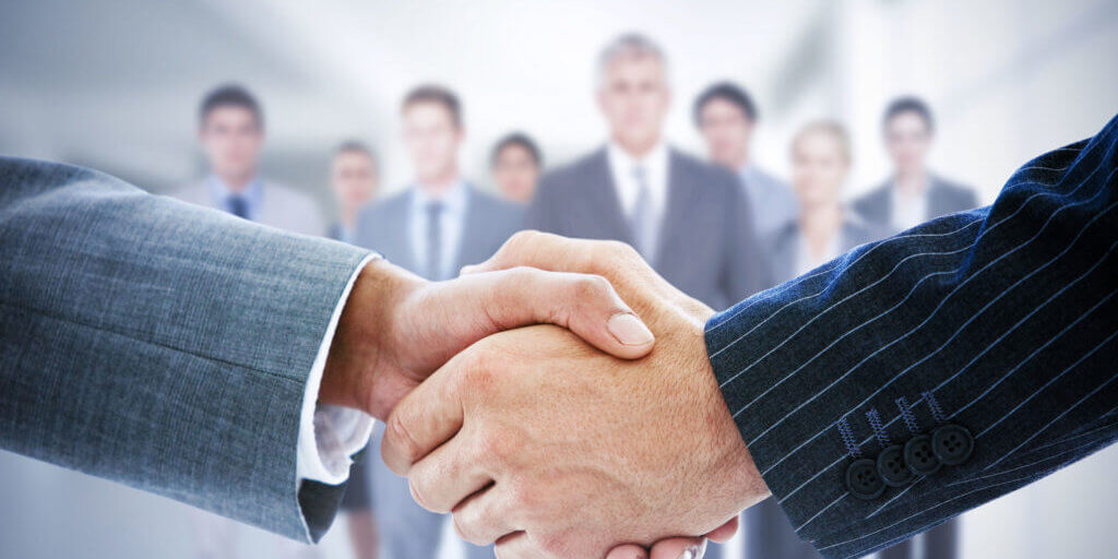 42323560 - composite image of business people shaking hands