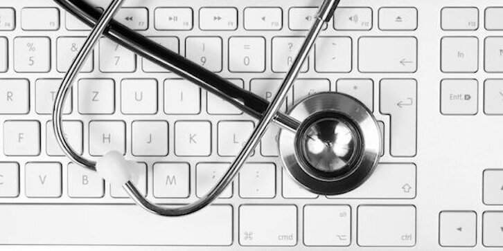 22477325 - stethoscope on computer keyboard