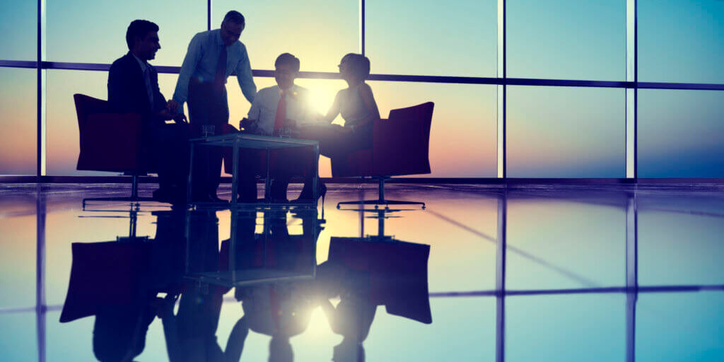 35340144 - group of business people meeting in back lit