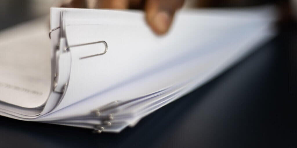 Photo by KATRIN BOLOVTSOVA httpswww.pexels.comphotoa-close-up-shot-of-a-person-going-through-documents-6077886