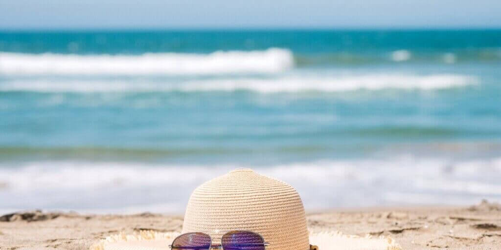Photo by Kindel Media httpswww.pexels.comphotobrown-sun-hat-on-beach-8093145