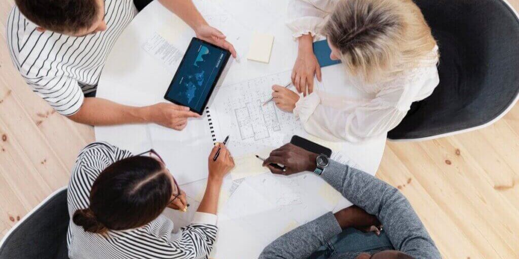 close-up-young-colleagues-having-meeting
