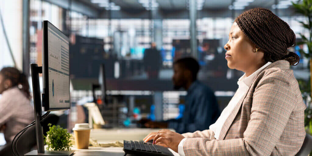 Successful confident businesswoman manages financial planning and project development. Focused female employee using her expertise achieve business objectives, administrative tasks.